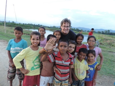 Mike with children in Nepal