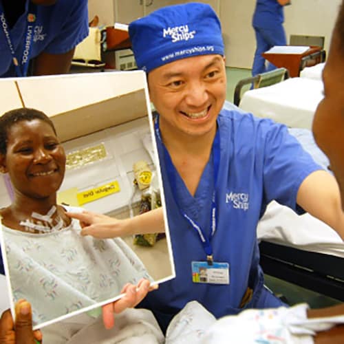 Mercy Ships recipient seeing themselves in the mirror following free surgery